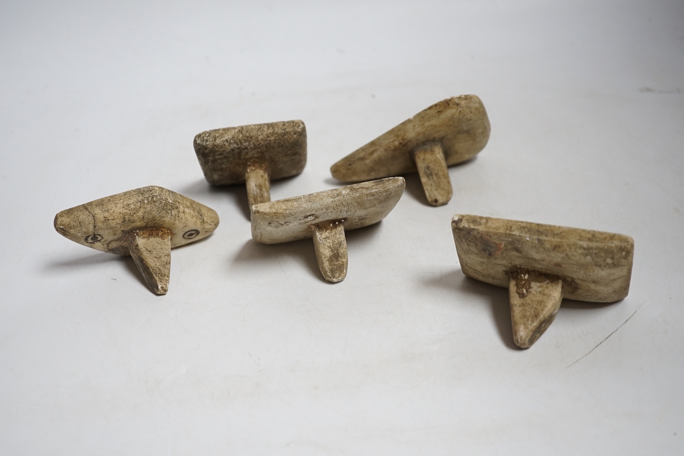 A group of five Middle eastern pottery moulds/stamps, largest, 10cm long